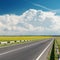 Asphalt road to cloudy horizon
