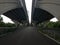 Asphalt and rocks underneath the Wilson Bridge in Alexandria, Virginia