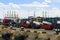 Asphalt roller and trucks waiting loading on a ship for import or export