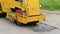 Asphalt roller at work, repair of pavement. Close-up