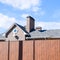 Asphalt shingle. Decorative bitumen shingles on the roof of a br