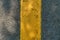 Asphalt texture with a yellow dividing strip. Top view