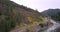 Asphalt winding road going along the mountain river