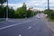 The asphalted road with white strips. The highway with a white marking