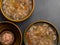 aspic meat jelle in bowls over concrete background