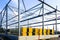 Assembled steel framework and stacks of sandwich panels for the facade of a new industrial building
