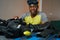 Assembling of scuba diving suit by mixed-race man