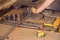 Assembly of reinforcing bars for pouring concrete. The worker is bending rebars with rebar bending machine in the site