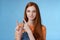 Assertive good-looking redhead girl know what talking about pointing upper left corner index fingers showing confidently