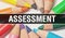 Assessment concept banner with texture from colorful items of education, science objects and 1 september School supplies.