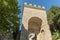 Assisi arch entrance Porta Nuova during sunny day