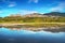 Assisi town skyline and reflection on the water. Perugia, Umbria, Italy