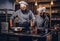 Assistant cook grinds sesame seeds in a mortar for cooking bread. Chef teaching his assistant to bake the bread in the