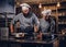 Assistant cook grinds sesame seeds in a mortar for cooking bread. Chef teaching his assistant to bake the bread in the