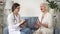 Assistant doctor visit elderly lady at her cozy house