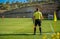 Assistant referee in a football match watching the game