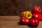 Assort of different shape and color bell pepper on wooden background