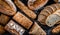 Assorted bakery products including loafs of bread and rolls