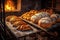 assorted bread loaves cooling on a rack by stone oven