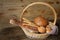 assorted bread and sesame breadsticks in a basket on a wooden rustic table with copy space for text