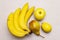 Assorted bright yellow fruits. Fresh banana, pear, apple, lemon. Harvest on a stone background
