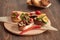 Assorted Bruschetta with fish, meat, vegetables and cheese on a wooden Board. Traditional Italian appetizer or appetizer,
