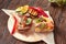 Assorted Bruschetta with fish, meat, vegetables and cheese on a wooden Board. Traditional Italian appetizer or appetizer,