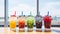 Assorted bubble tea glasses displayed on a bright table in a stylish and modern cafe setting