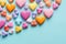 Assorted Candy Heart Shapes on Light Banner: Sweet Valentine\\\'s Day Treats.