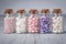 Assorted candy sprinkles in mini glass bottle