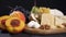 Assorted cheese on wooden board. Hard cheese, brie, dor blue, cheese with mold, cheese with holes. Organic fresh