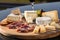 Assorted cheese on a wooden platter for tasting