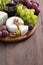 Assorted cheeses and fresh grapes on the board