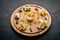 Assorted cheeses, gorgonzola, brie, feta, with honey. On a wooden background.