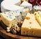 Assorted cheeses with mold, Maasdam, Roquefort, brie and others