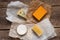 Assorted cheeses on the wooden table