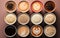 Assorted coffee cups isolated top view on beige background