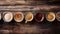Assorted coffee mugs on wooden table overhead view with variety of shapes and sizes