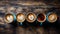 Assorted coffee mugs on wooden table overhead view with variety of styles and colors
