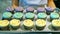 Assorted color cupcakes on tray