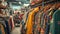 Assorted colorful clothing on hangers in a boutique. Fashion and retail concept