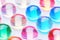 Assorted Colorful Glass Marbles on White Background