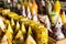 Assorted colorful yellow wax candles in a shop