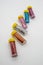 Assorted colors craft glitter in small tubes with yellow caps is