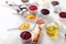 Assorted Condiments on White Wooden Table