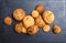 Assorted cookies with chocolate chip, oatmeal raisin on stone slate background on wooden background close up. Homemade baking