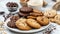 Assorted Cookies with Edible Insects. A plate of assorted chocolate chip and butter cookies, whimsically decorated with