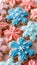 Assorted cookies with vintage quilt pattern icing in blue and pink on multi colored dough background