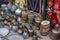 Assorted copperware and rugs on flea market