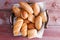 Assorted crusty fresh bread rolls in a basket